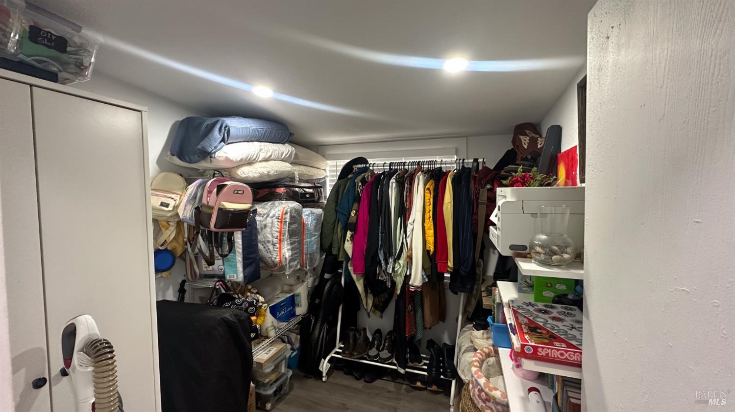 4532 Pine Street Lucerne, CA 95458 - Photo 22 of 34 a view of walk in closet with clothes and shoes