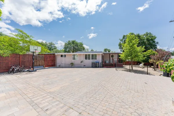 an aerial view of a house with outdoor space
