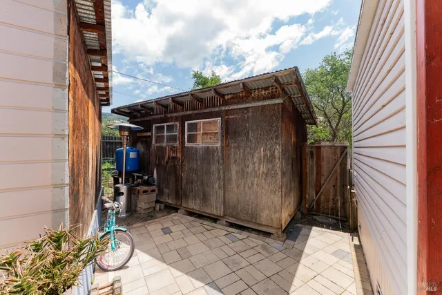 a view of wooden door in front of house