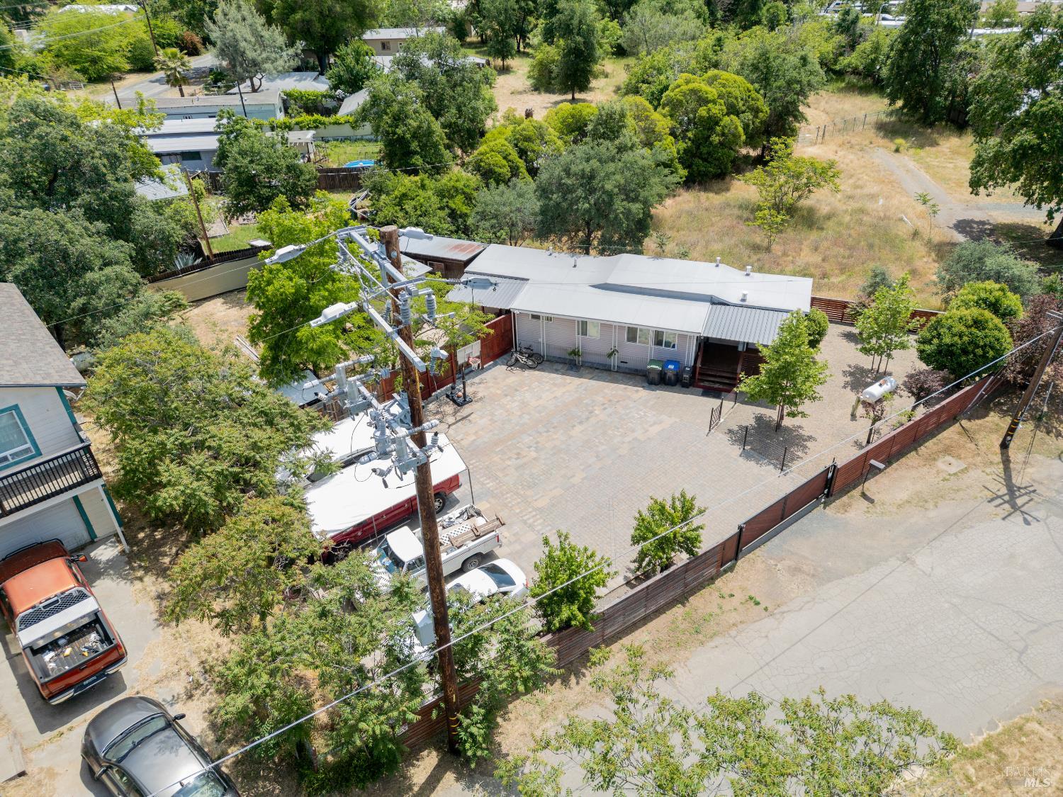 4532 Pine Street Lucerne, CA 95458 - Photo 31 of 34 an aerial view of a house with a yard and potted plants