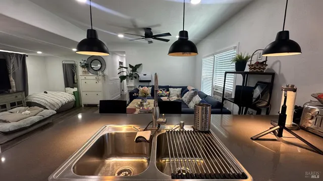a dinning room with furniture and a chandelier