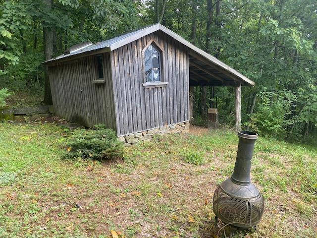 380 Little Cabin Road Amherst, VA 24521 - Photo 10 of 12 a backyard of a house with lots of green space
