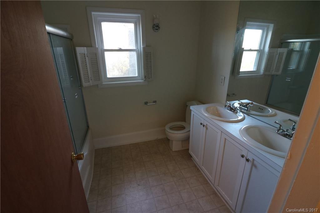 14475 Cabarrus Station Road Midland, NC 28107 - Photo 11 of 23 a bathroom with a sink toilet and mirror