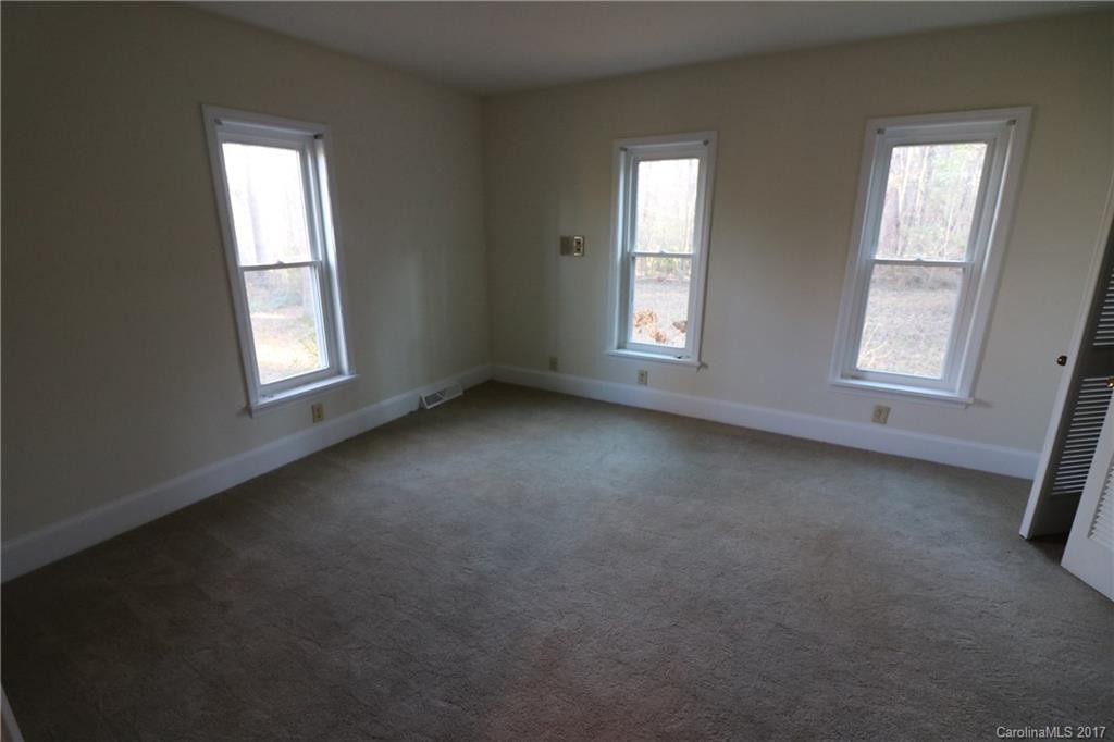 14475 Cabarrus Station Road Midland, NC 28107 - Photo 12 of 23 an empty room with windows