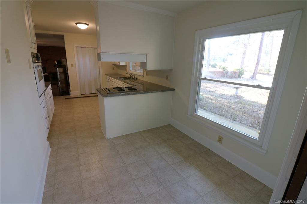 14475 Cabarrus Station Road Midland, NC 28107 - Photo 18 of 23 a view of a kitchen with furniture and a window