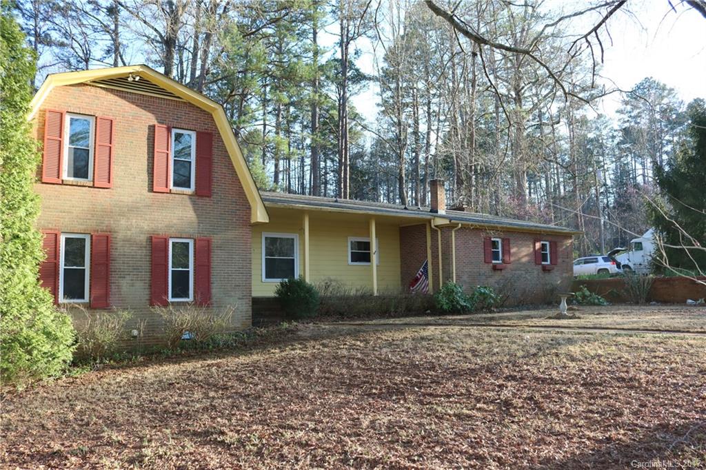 14475 Cabarrus Station Road Midland, NC 28107 - Photo 19 of 23 a front view of a house with garden