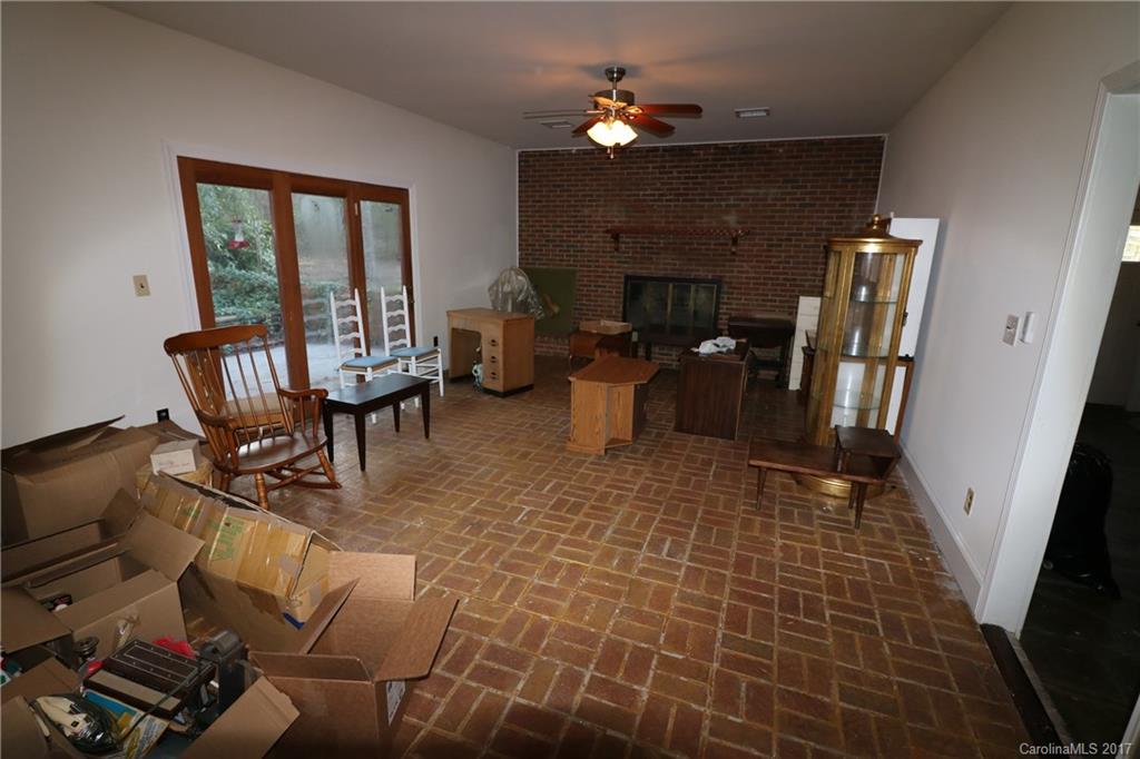 14475 Cabarrus Station Road Midland, NC 28107 - Photo 20 of 23 a living room with fireplace furniture and a window