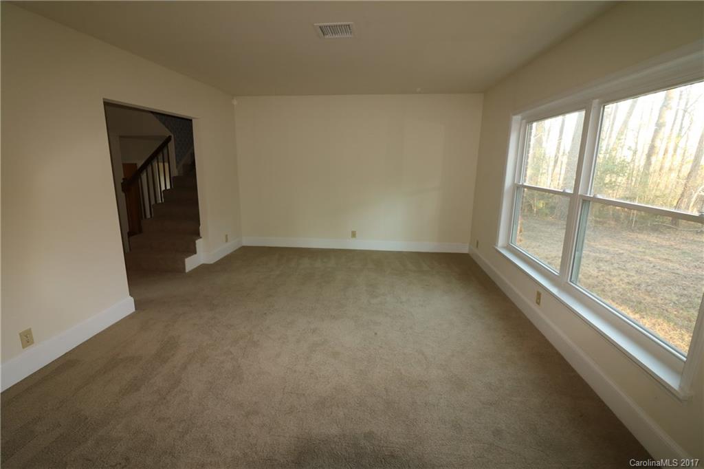 14475 Cabarrus Station Road Midland, NC 28107 - Photo 6 of 23 en empty room with windows