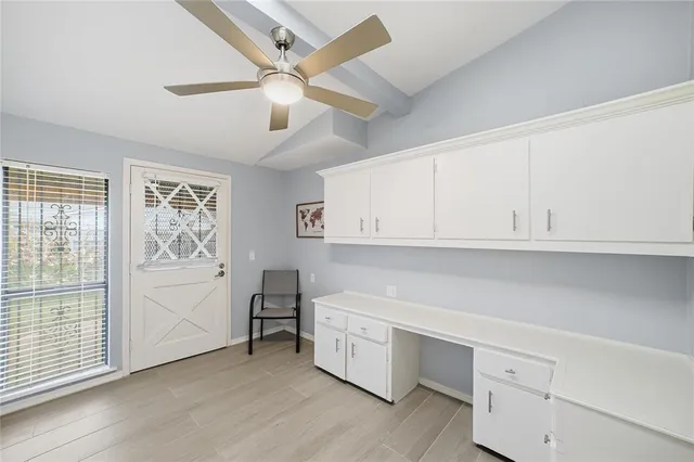 a view of cabinets and window