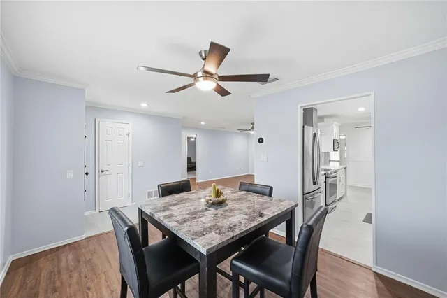 a view of a dining table and chairs in a room