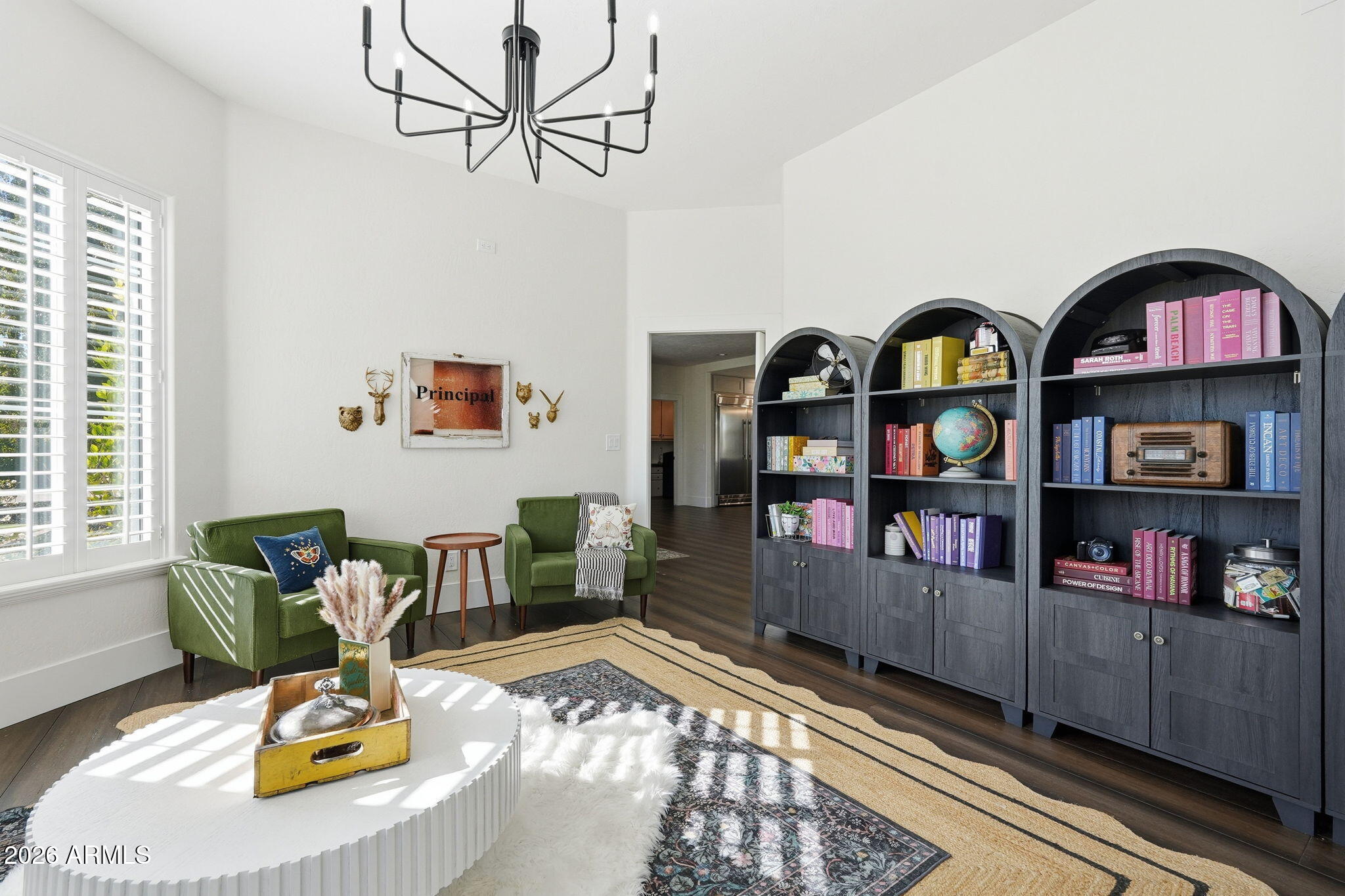 4222 East McLellan Road, Unit 15 Mesa, AZ 85205 - Photo 16 of 86 a living room with lots of furniture and book shelf