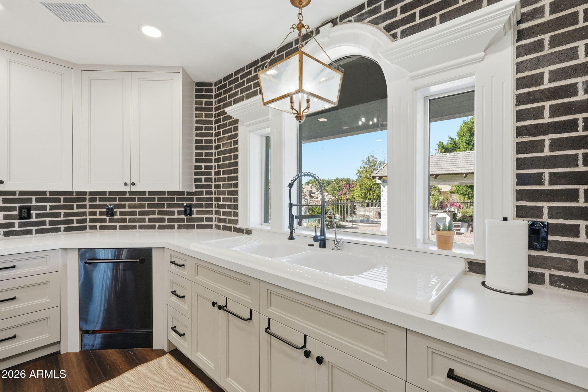 4222 East McLellan Road, Unit 15 Mesa, AZ 85205 - Photo 22 of 86 a kitchen with a sink and a large mirror