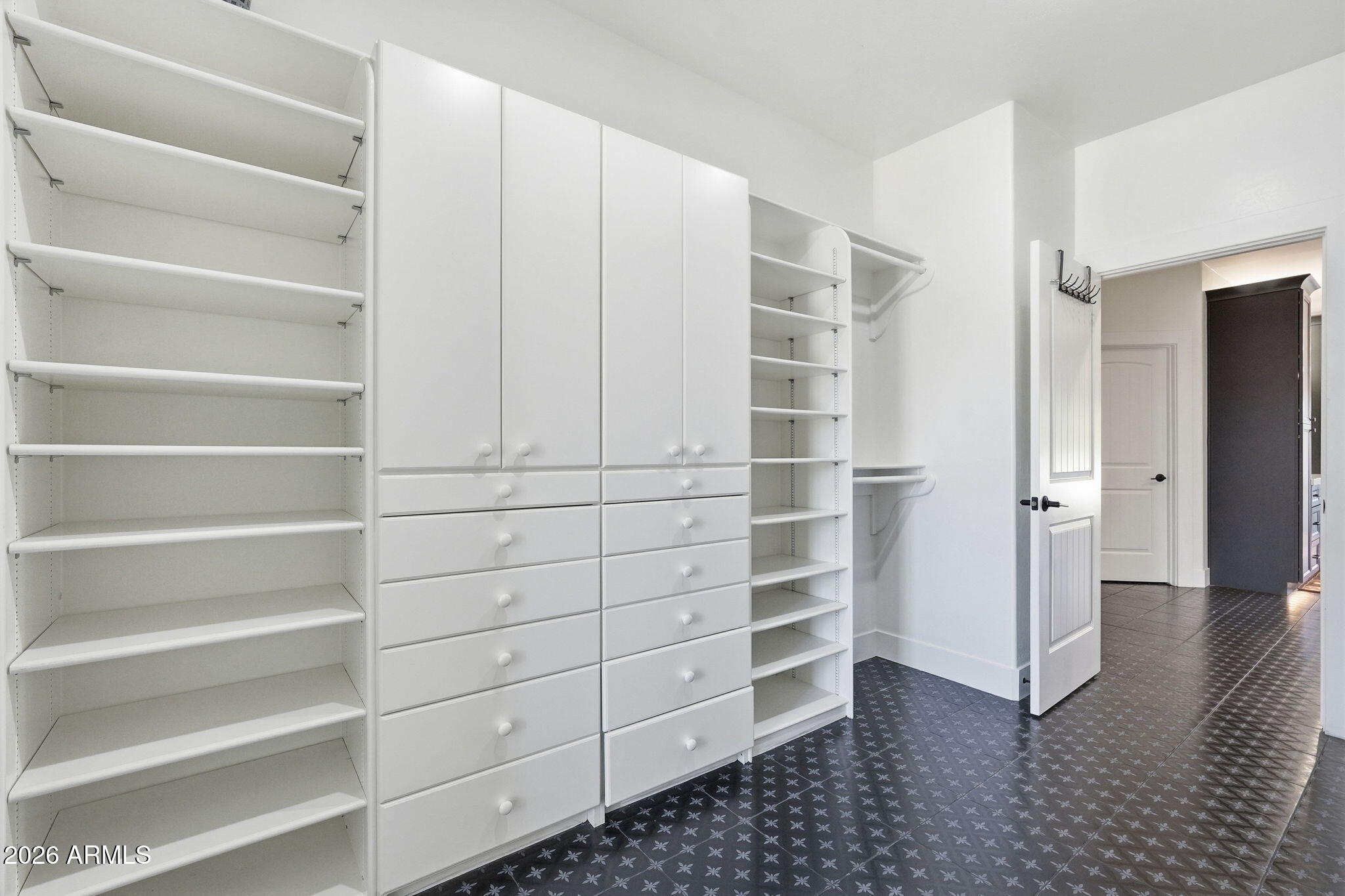 4222 East McLellan Road, Unit 15 Mesa, AZ 85205 - Photo 39 of 86 a view of walk in closet with empty racks