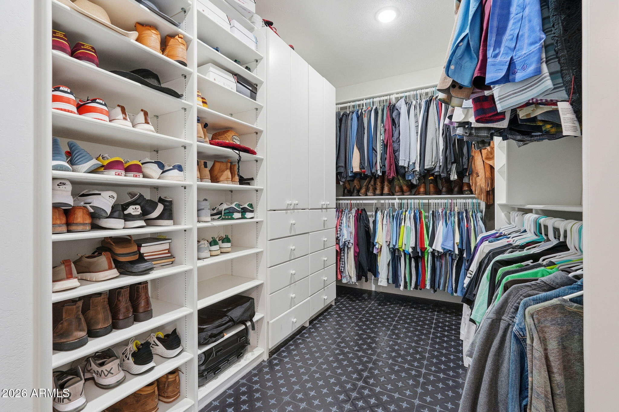 4222 East McLellan Road, Unit 15 Mesa, AZ 85205 - Photo 41 of 86 a view of walk in closet with clothes and shoes