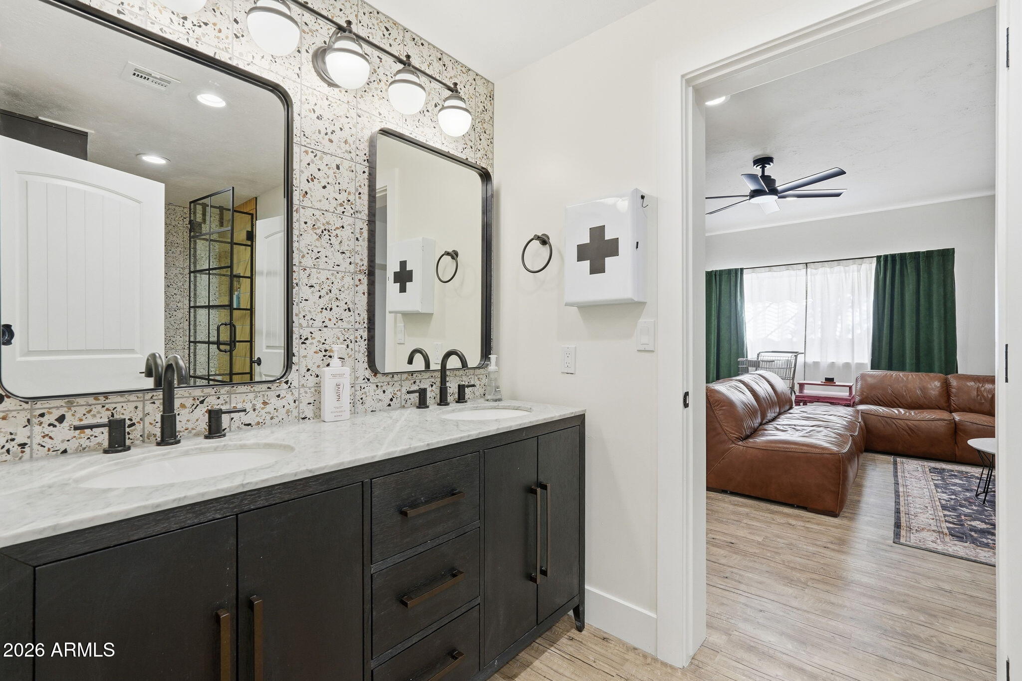 4222 East McLellan Road, Unit 15 Mesa, AZ 85205 - Photo 53 of 86 a en suite bathroom with a double vanity sink and a mirror