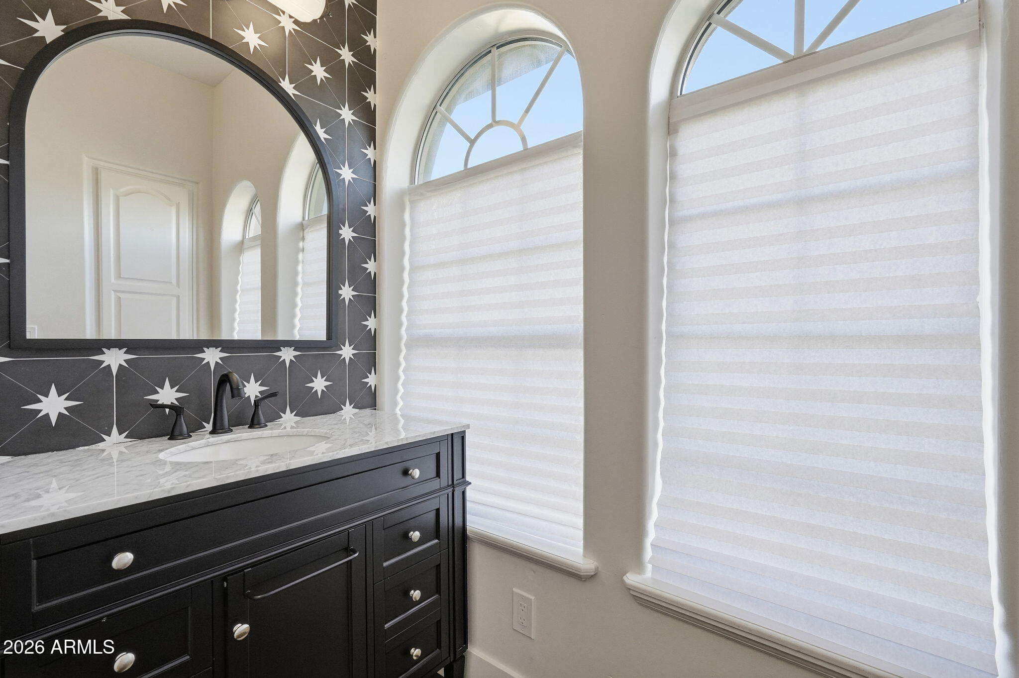 4222 East McLellan Road, Unit 15 Mesa, AZ 85205 - Photo 57 of 86 a bathroom with a sink and a mirror