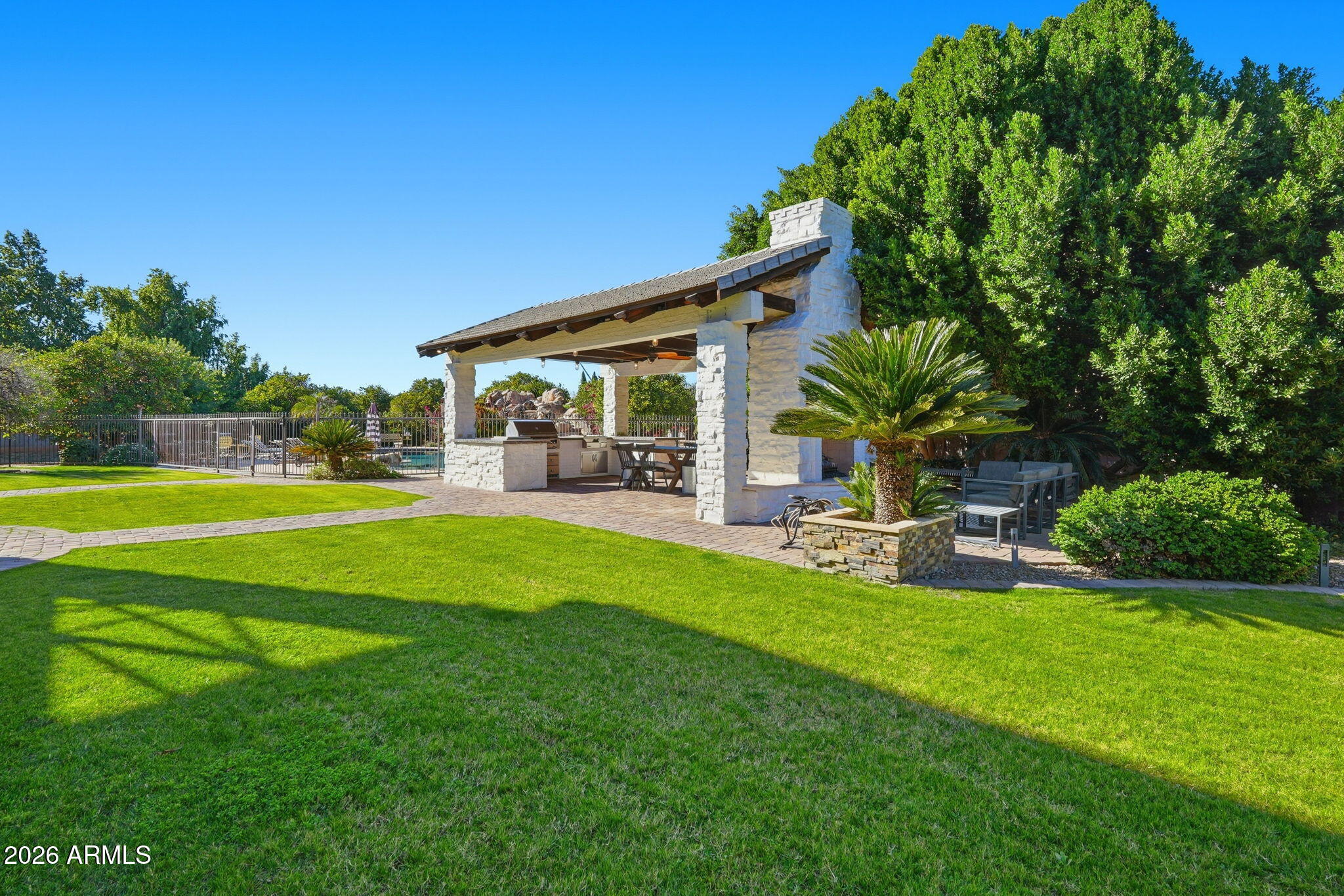 4222 East McLellan Road, Unit 15 Mesa, AZ 85205 - Photo 78 of 86 a view of a house with a yard porch and sitting area