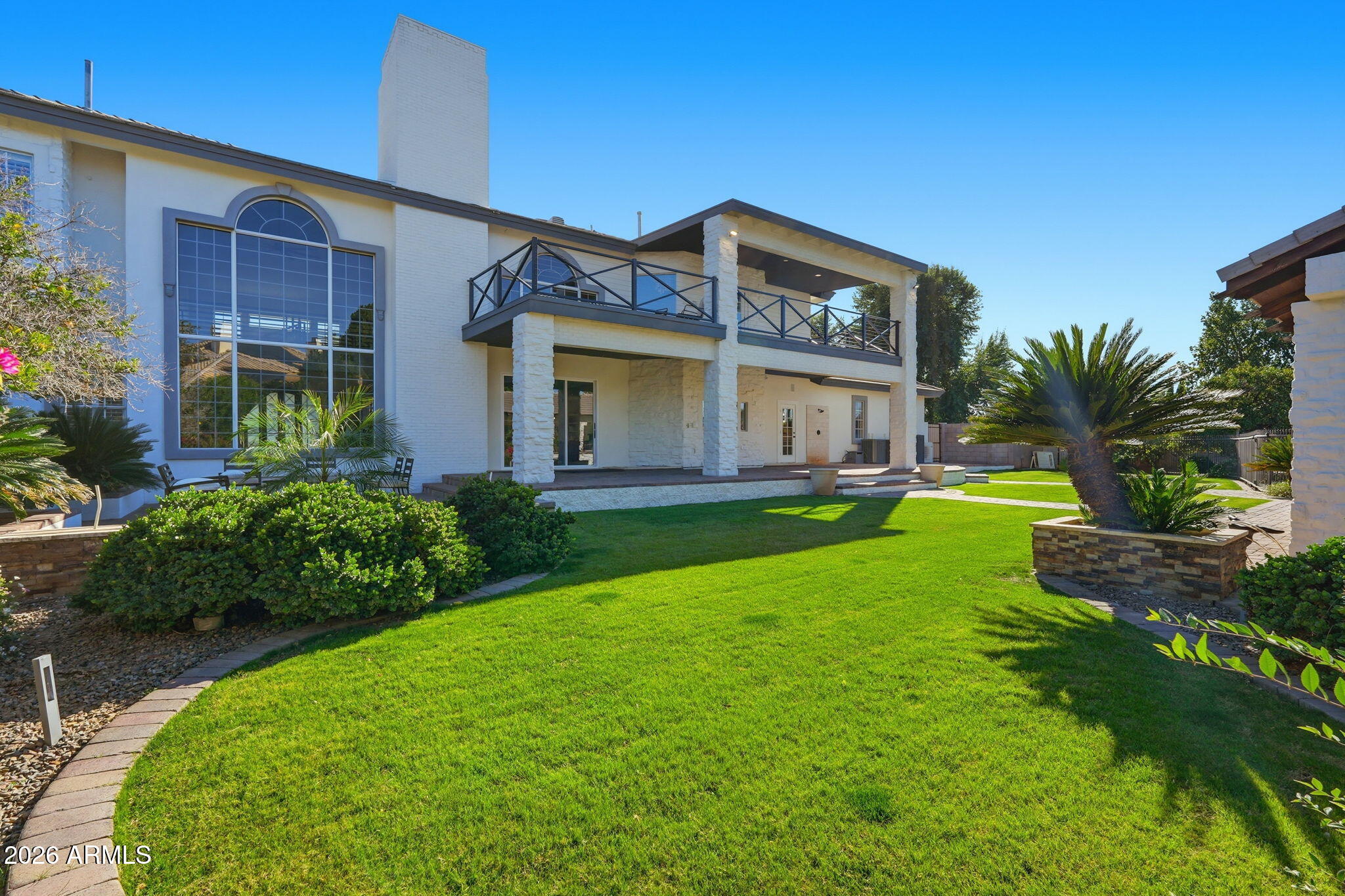4222 East McLellan Road, Unit 15 Mesa, AZ 85205 - Photo 84 of 86 a view of a house with a yard porch and sitting area