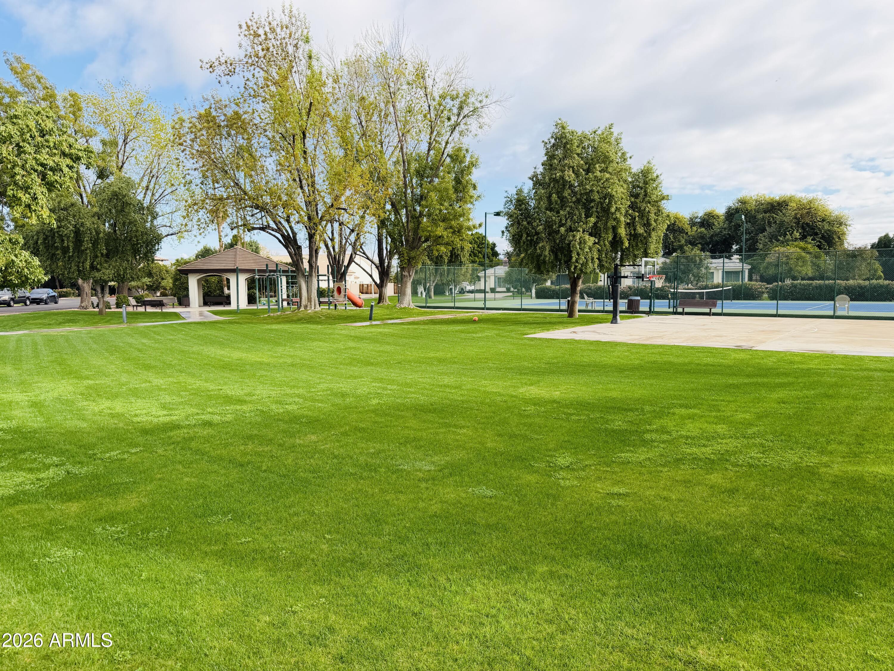 4222 East McLellan Road, Unit 15 Mesa, AZ 85205 - Photo 86 of 86 a front view of a house with a yard