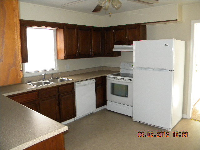 5331 Twilight Road Roanoke, VA 24019 - Photo 6 of 14 a kitchen with cabinets and white appliances