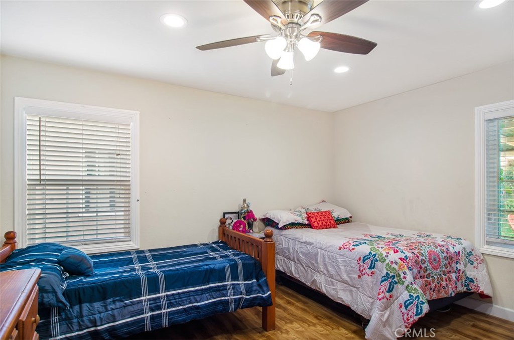 7192 9th Street Buena Park, CA 90621 - Photo 12 of 24 a bedroom with a bed and a chandelier