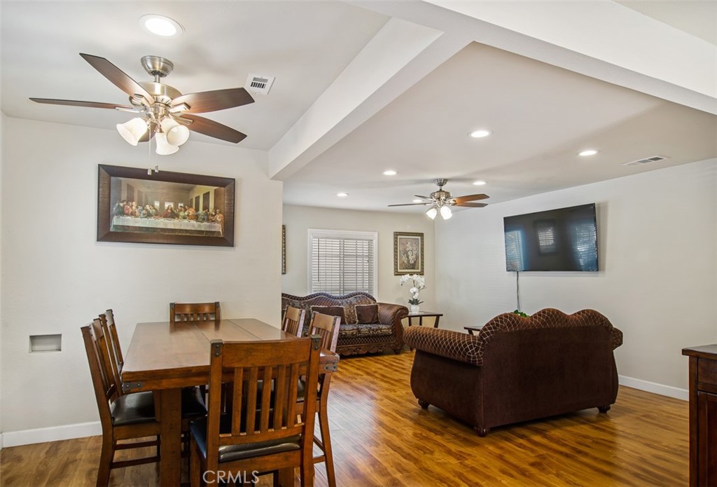 7192 9th Street Buena Park, CA 90621 - Photo 3 of 24 a living room with furniture a window and a flat screen tv