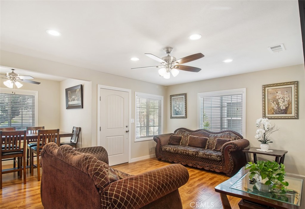 7192 9th Street Buena Park, CA 90621 - Photo 5 of 24 a living room with furniture ceiling fan and a window