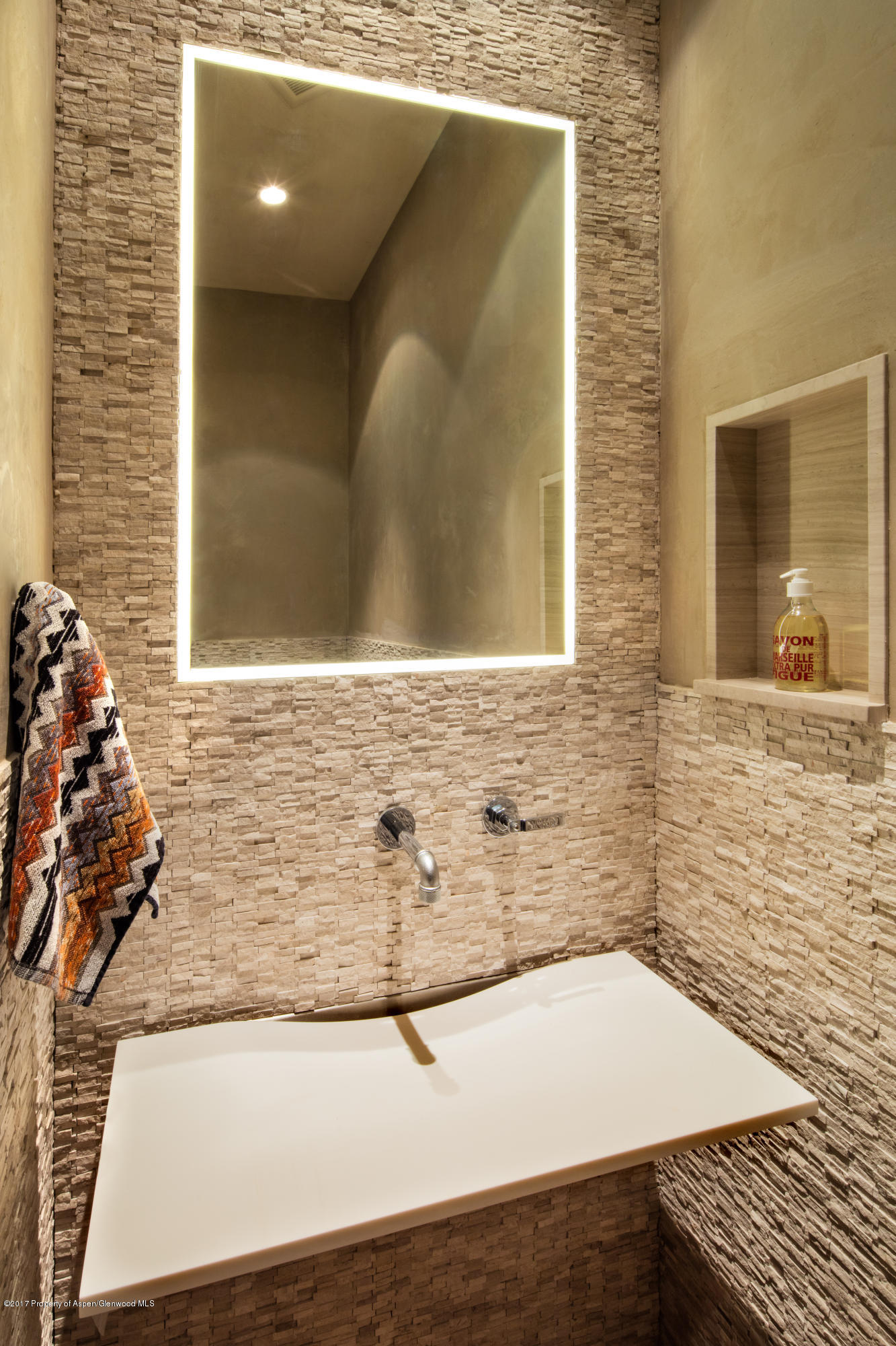 1195 Riverside Drive Aspen, CO 81611 - Photo 14 of 19 a bathroom with a granite countertop sink and a mirror