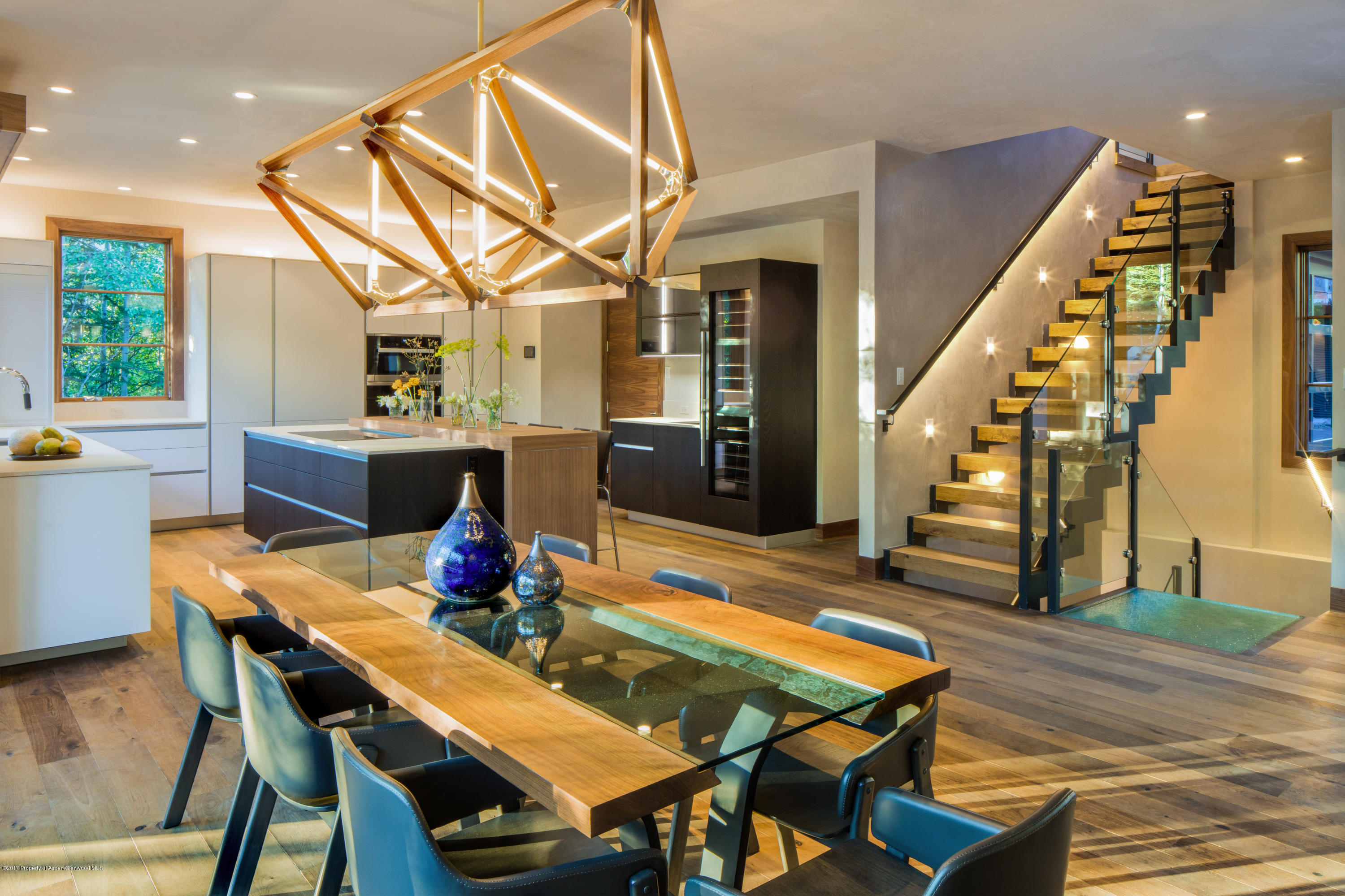1195 Riverside Drive Aspen, CO 81611 - Photo 4 of 19 a view of a dining room with furniture window and wooden floor