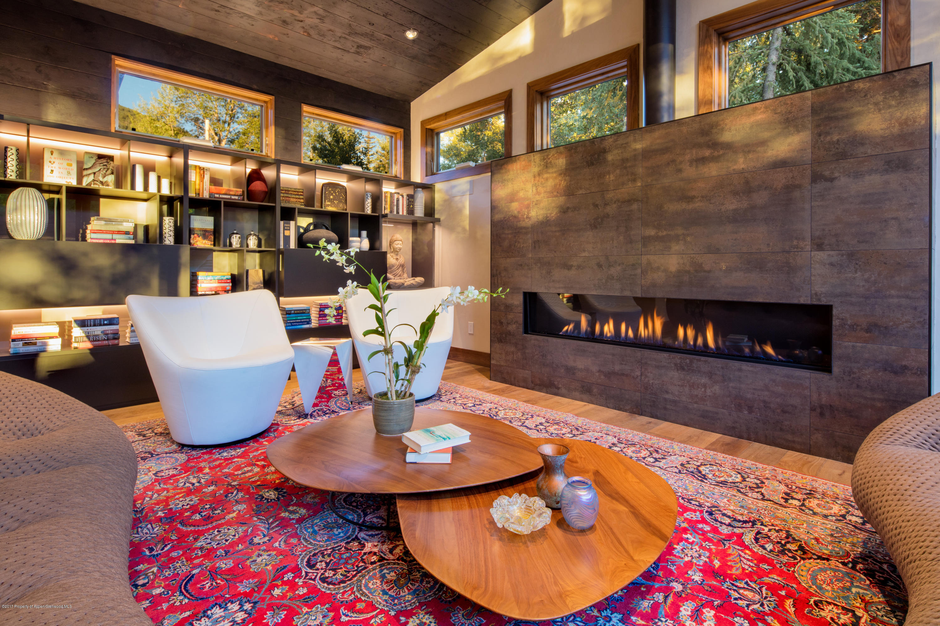 1195 Riverside Drive Aspen, CO 81611 - Photo 5 of 19 a dining room with furniture and a fireplace