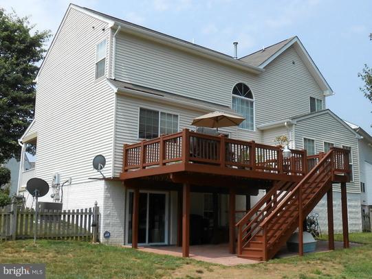 2685 Pheasant Hunt Road Woodbridge, VA 22192 - Photo 2 of 24 a view of a house with wooden stairs and a fence