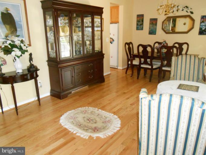 2685 Pheasant Hunt Road Woodbridge, VA 22192 - Photo 11 of 24 a living room with furniture and wooden floor