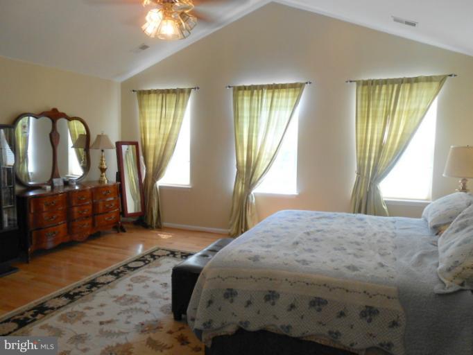 2685 Pheasant Hunt Road Woodbridge, VA 22192 - Photo 18 of 24 a bedroom with a bed window and dresser
