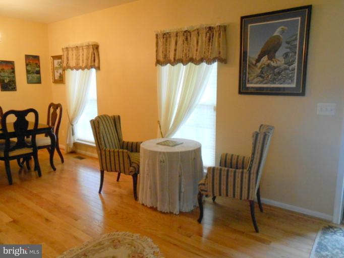 2685 Pheasant Hunt Road Woodbridge, VA 22192 - Photo 23 of 24 a dining room with furniture and wooden floor