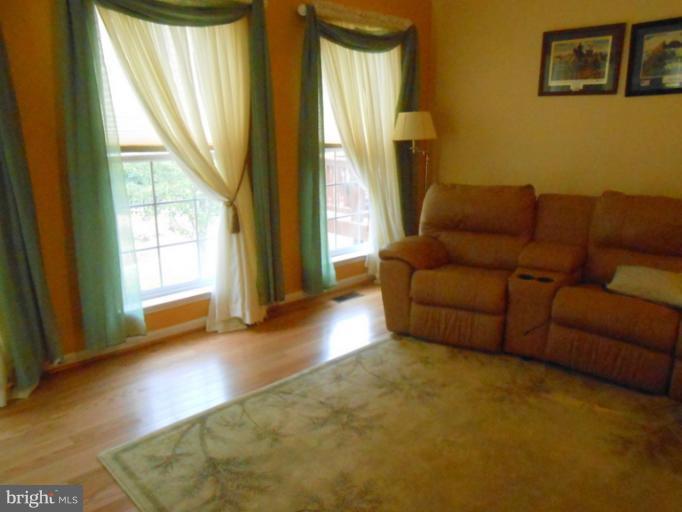 2685 Pheasant Hunt Road Woodbridge, VA 22192 - Photo 8 of 24 a living room with furniture and a large window