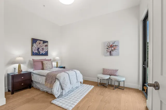 a bedroom with a bed and a couch