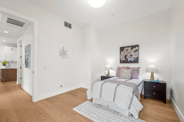 a bedroom with a bed and a view of bathroom
