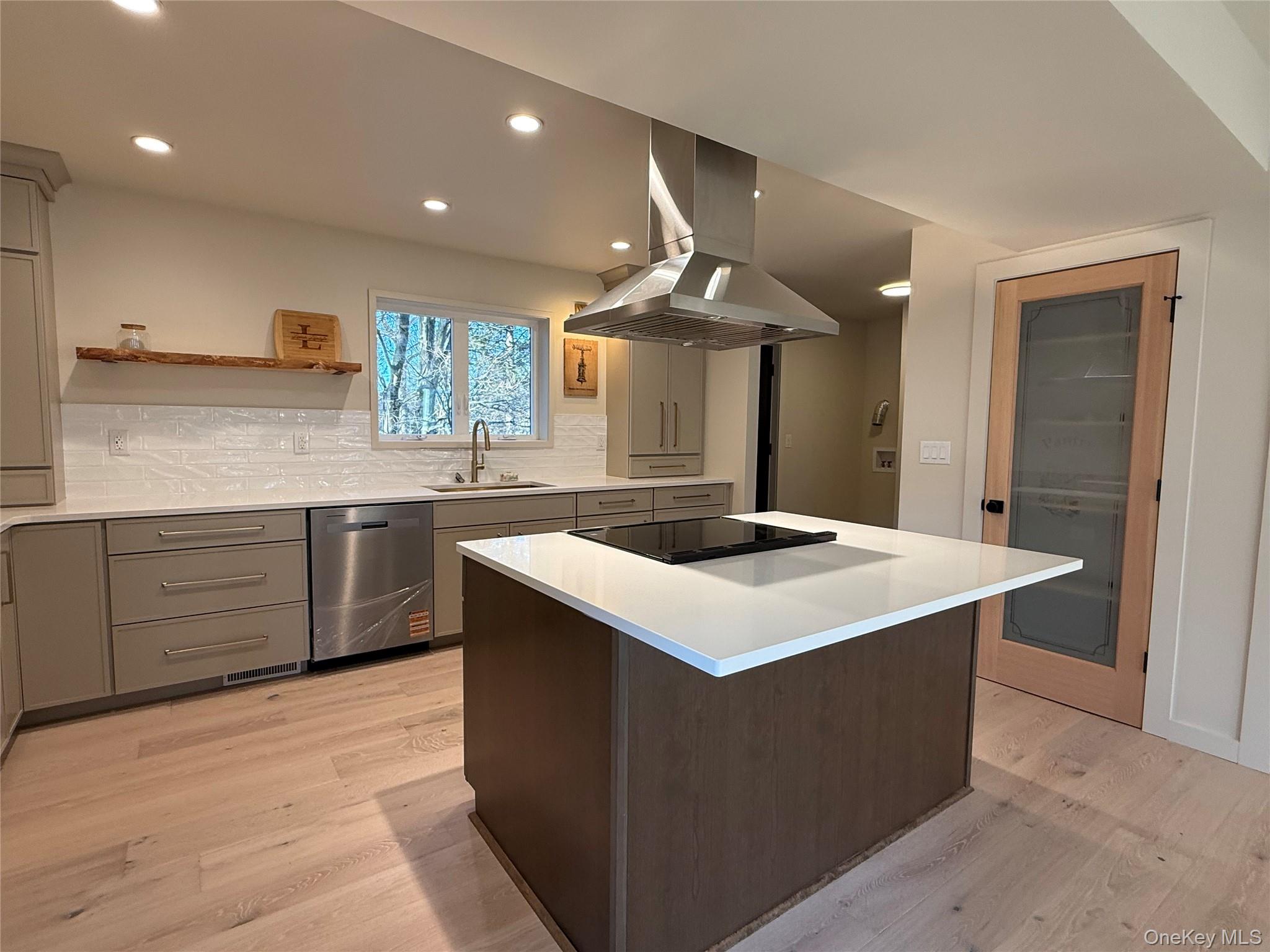 39 Falconer Street Beacon, NY 12508 - Photo 12 of 49 a kitchen with a stove a sink and a refrigerator