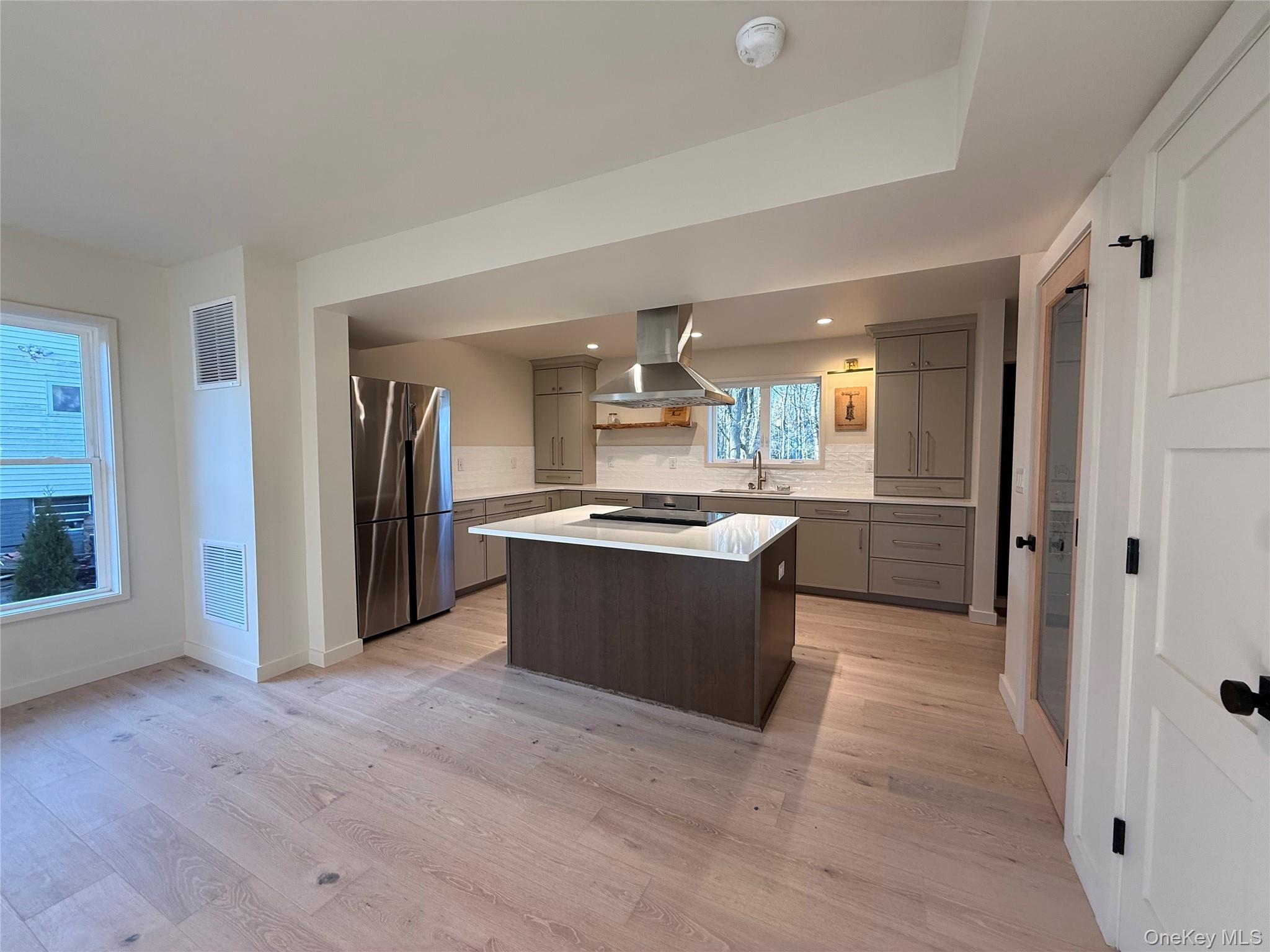 39 Falconer Street Beacon, NY 12508 - Photo 15 of 49 a large kitchen with a large counter top and stainless steel appliances