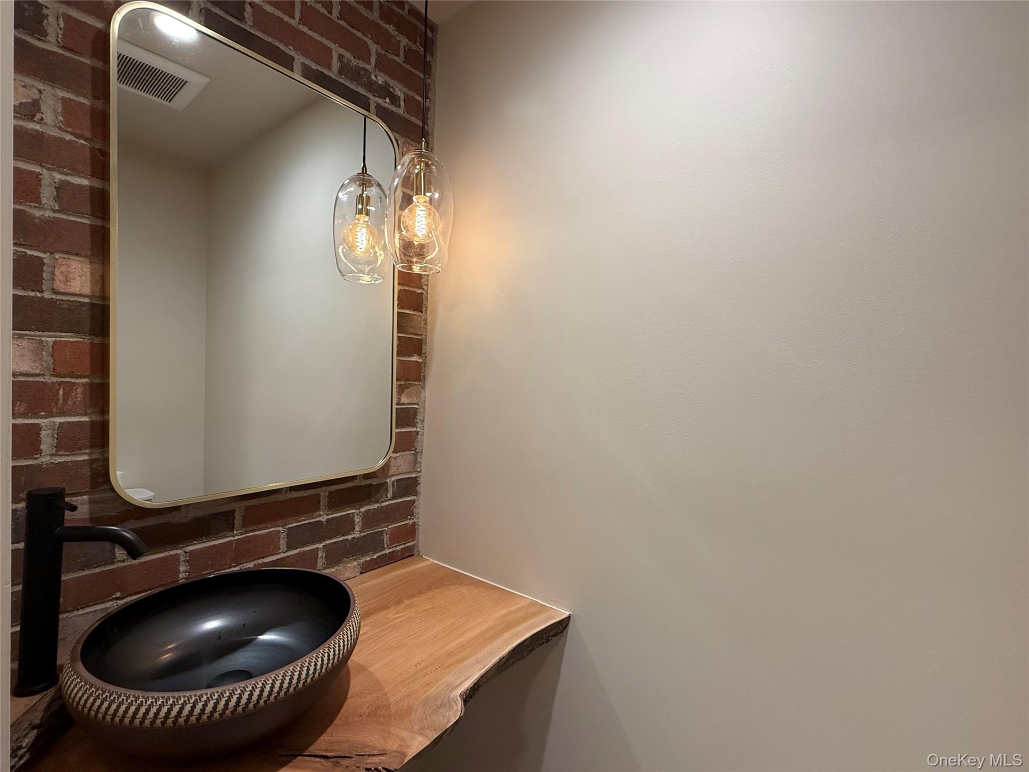 39 Falconer Street Beacon, NY 12508 - Photo 20 of 49 a bathroom with a sink and a mirror