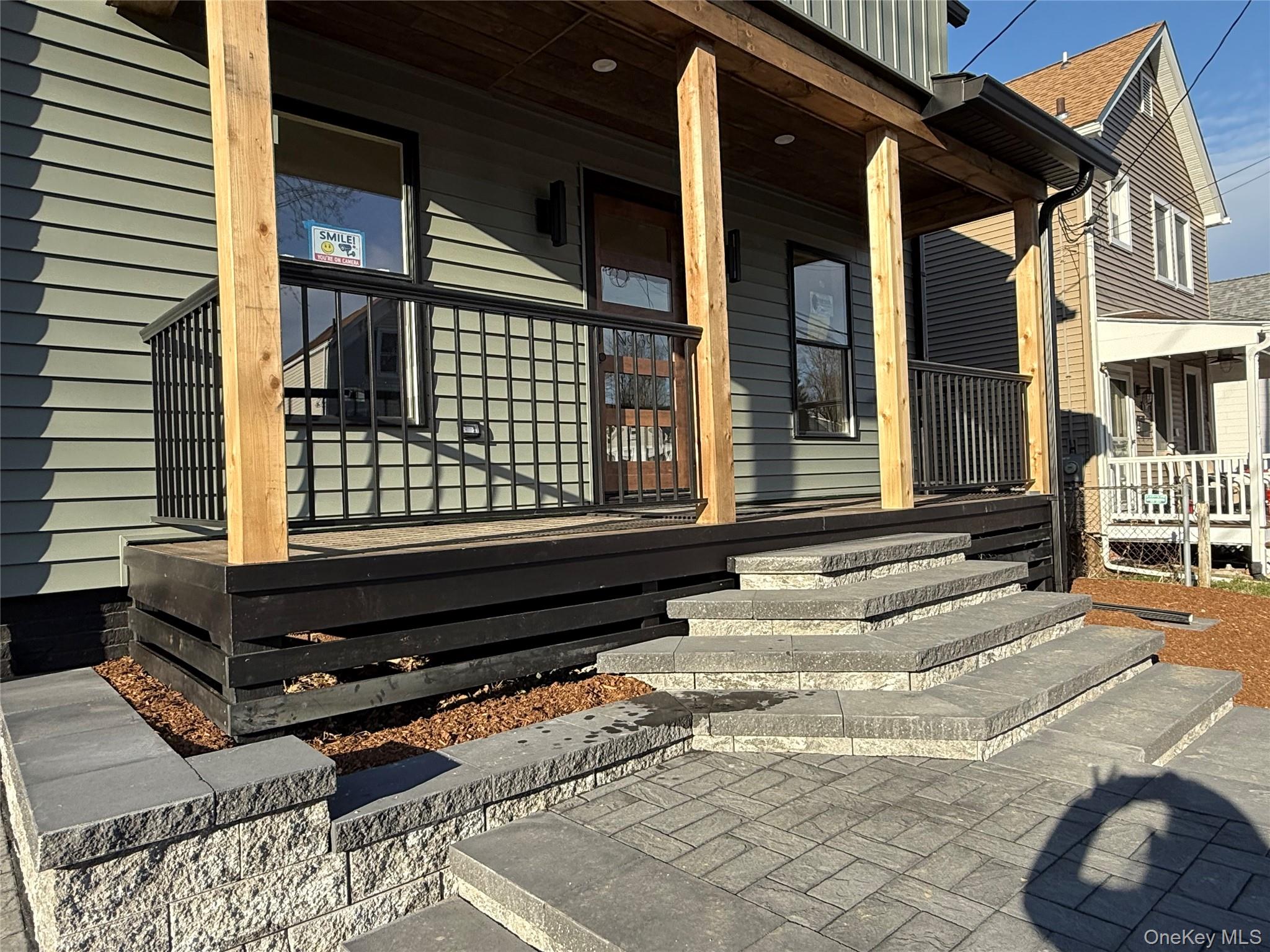 39 Falconer Street Beacon, NY 12508 - Photo 48 of 49 a backyard of a house with barbeque oven and outdoor seating