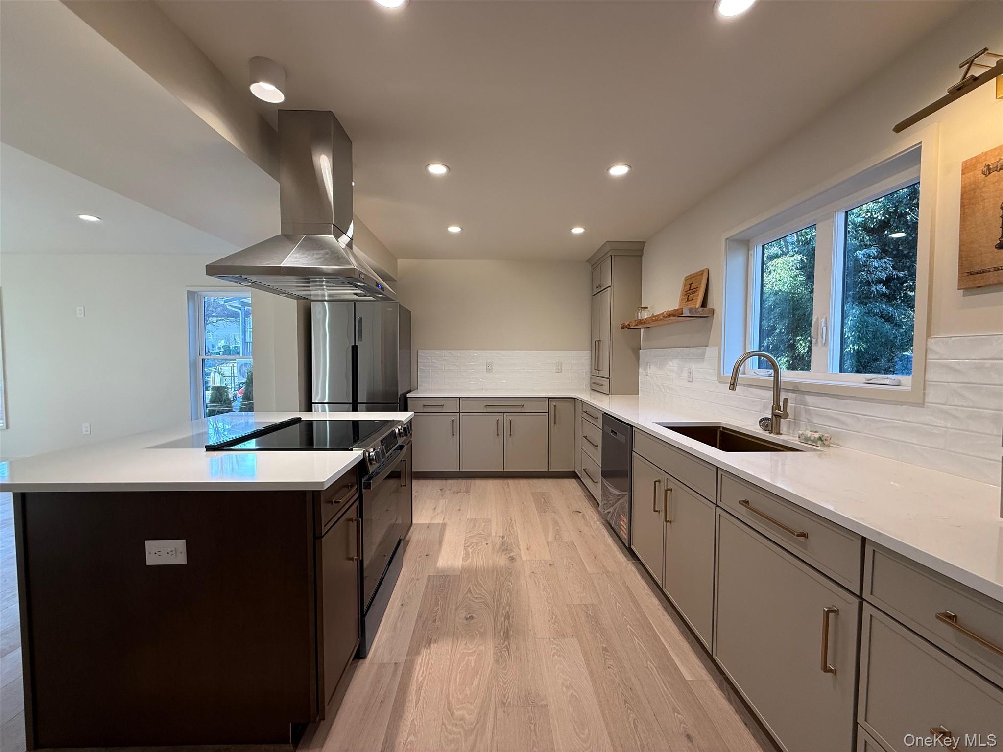 39 Falconer Street Beacon, NY 12508 - Photo 5 of 49 a kitchen with stainless steel appliances a sink stove and cabinets