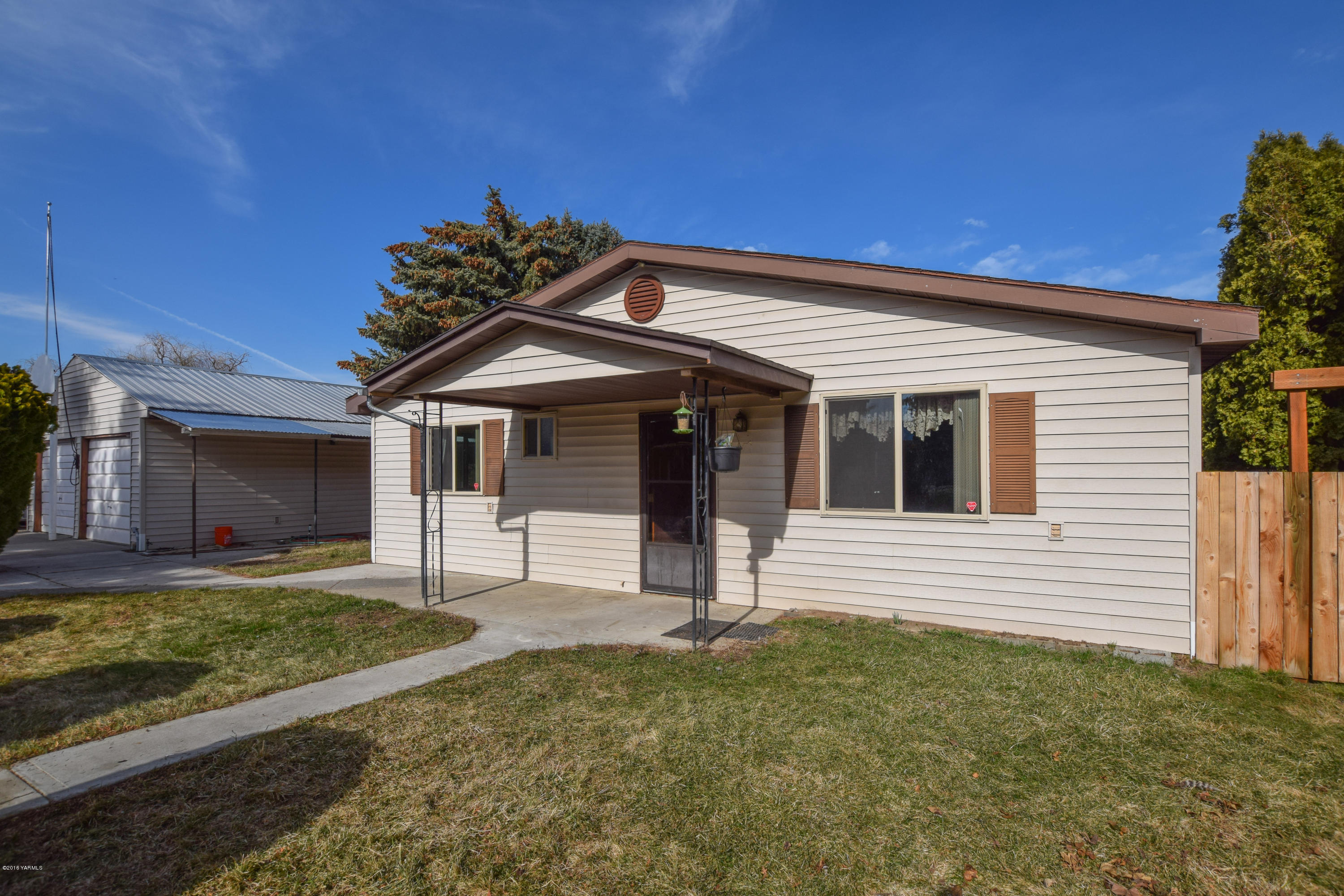 12301 Rutherford Road Yakima, WA 98903 - Photo 1 of 34 a view of a house with a garden and yard