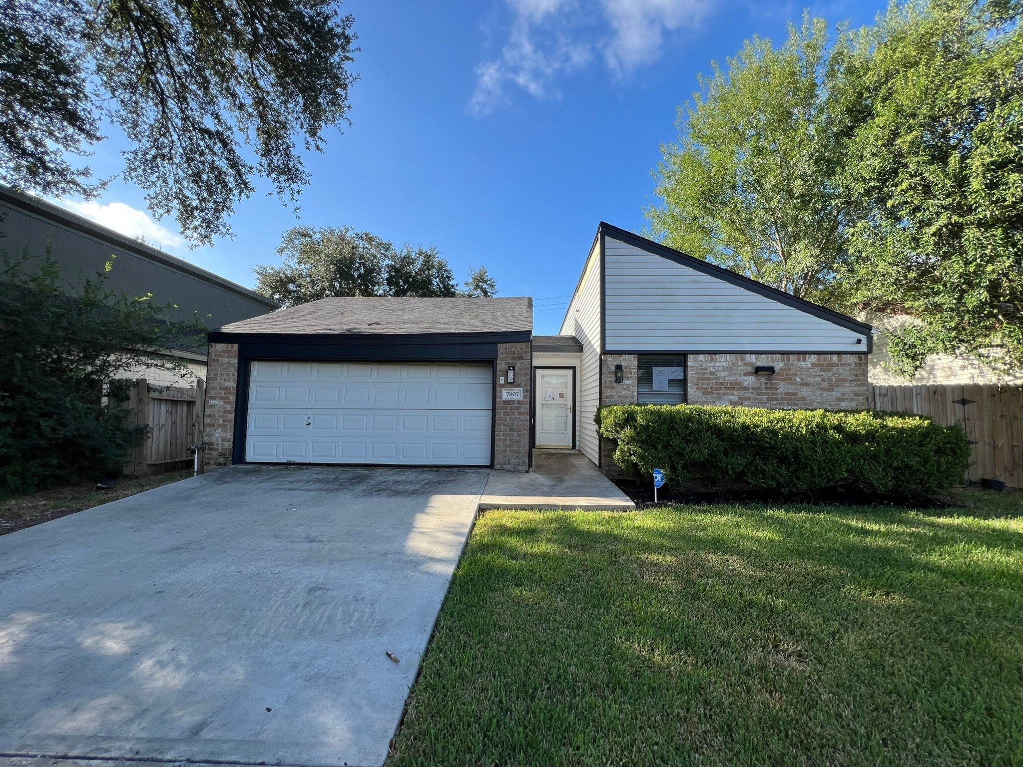 7807 Secretariat Lane Houston, TX 77071 - Photo 15 of 15 a front view of a house with a yard and garage