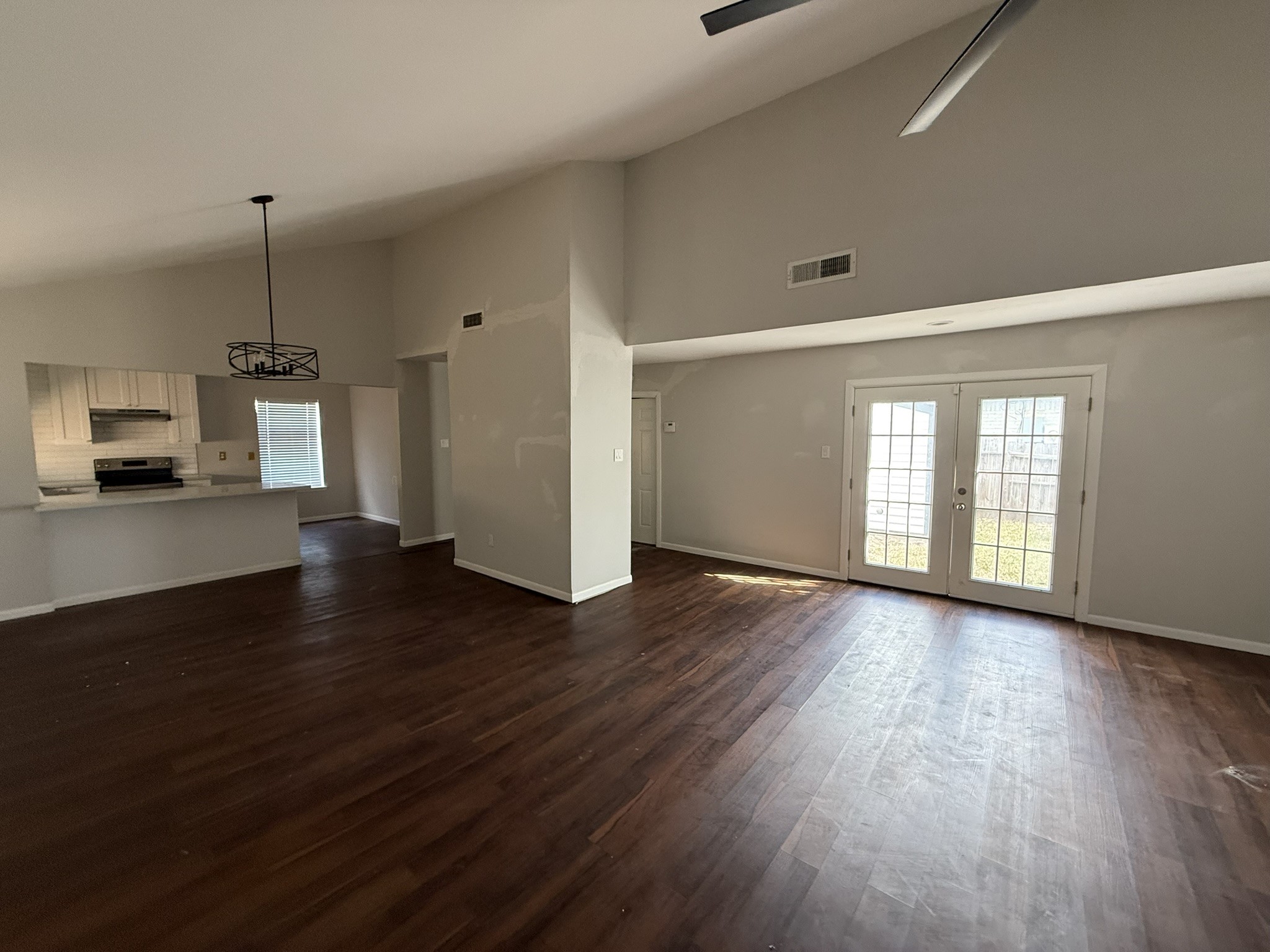 7807 Secretariat Lane Houston, TX 77071 - Photo 7 of 15 a view of empty room with wooden floor and fireplace