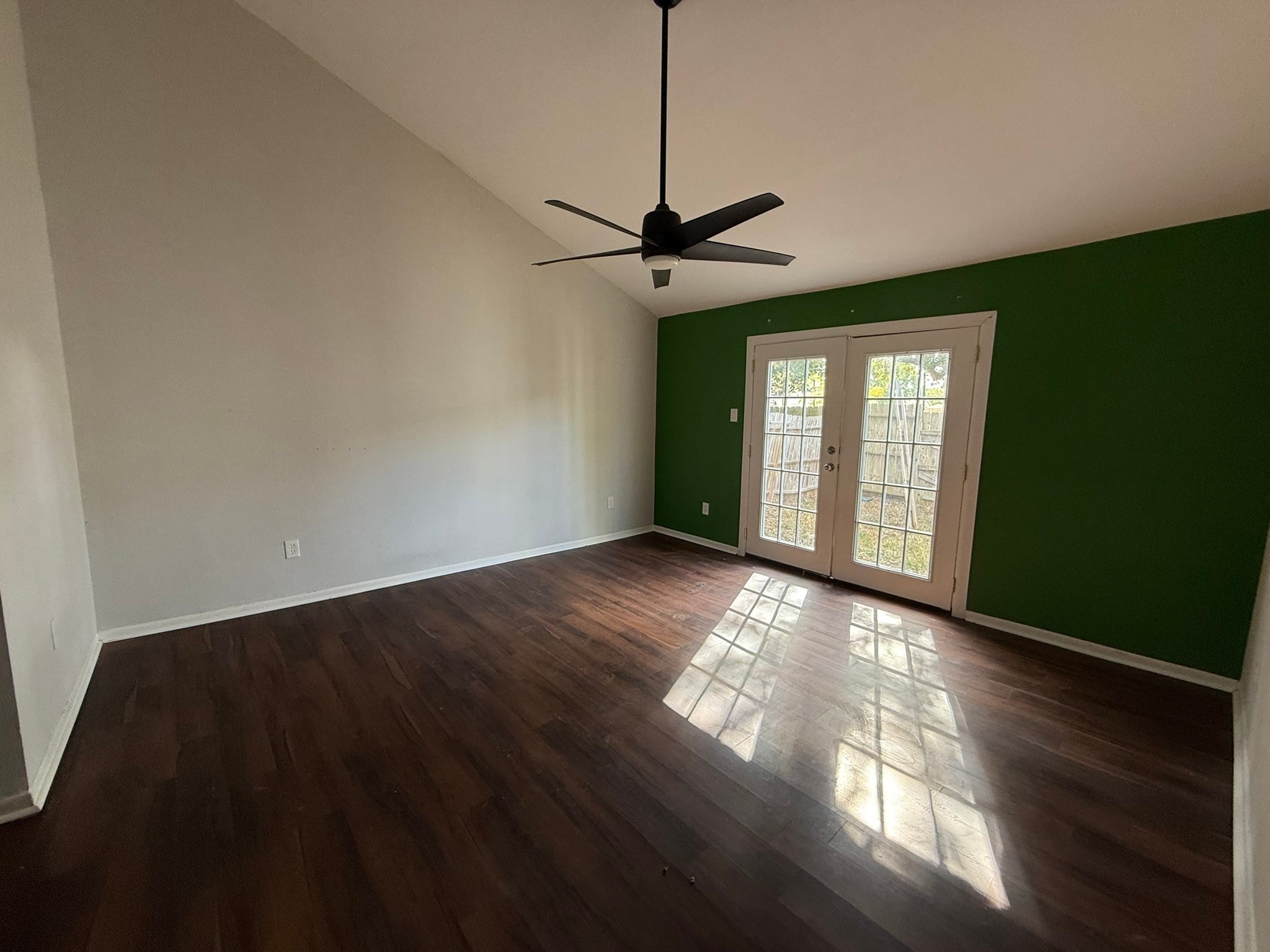 7807 Secretariat Lane Houston, TX 77071 - Photo 10 of 15 a view of an empty room with wooden floor and a window