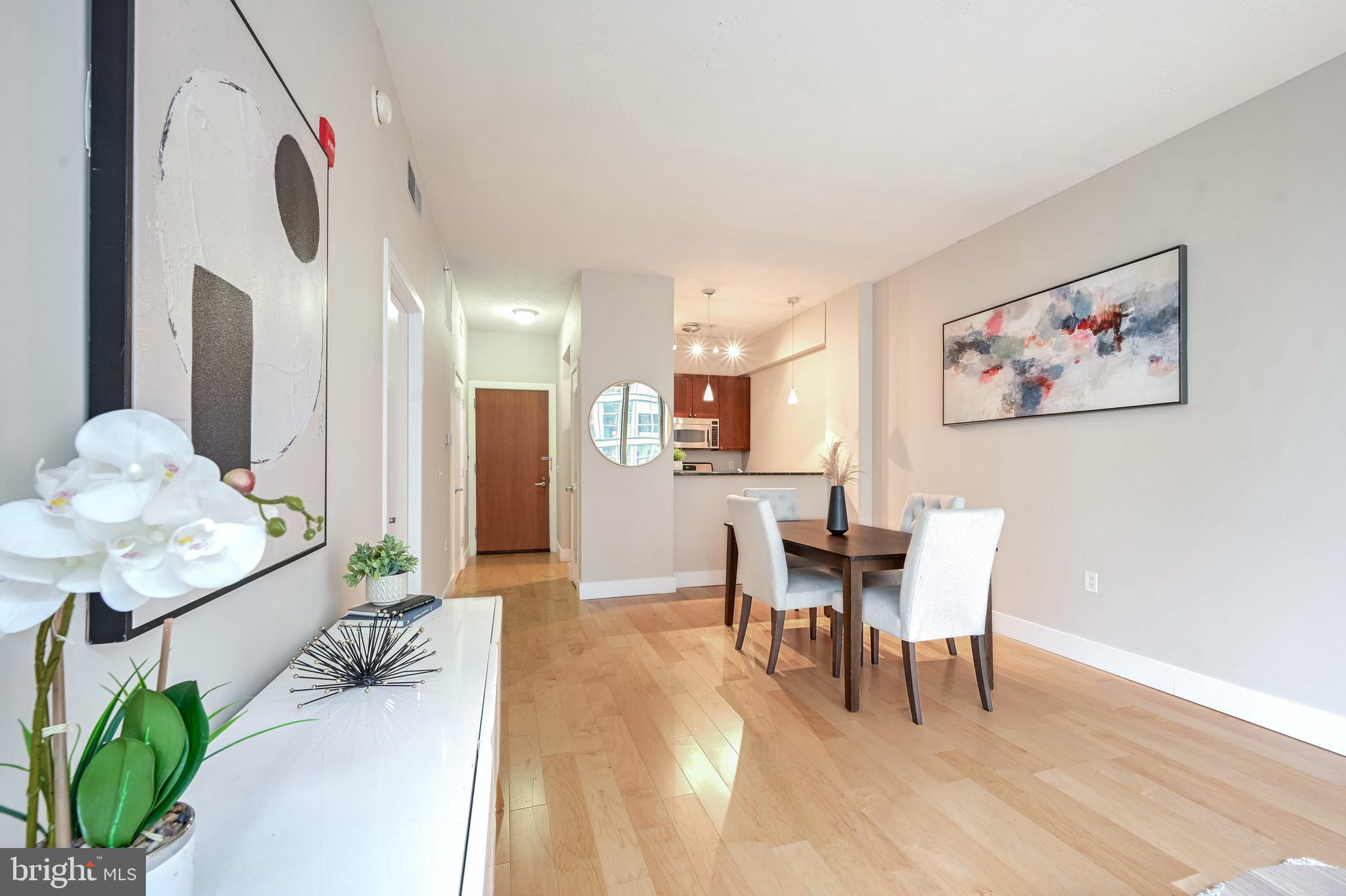 2120 Vermont Avenue Northwest, Unit 402 Washington, DC 20001 - Photo 9 of 41 a dining room with furniture and wooden floor