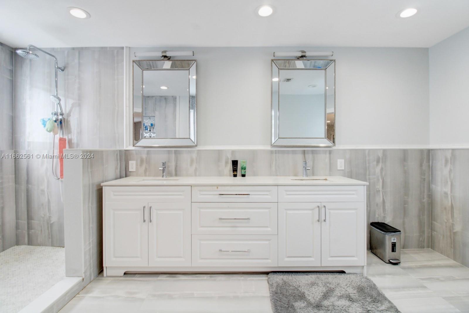 13505 Southwest 119th Street Miami, FL 33186 - Photo 13 of 25 a bathroom with a sink vanity and mirror