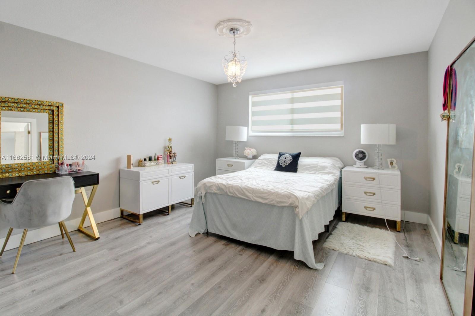 13505 Southwest 119th Street Miami, FL 33186 - Photo 17 of 25 a bedroom with a bed and a chair in it