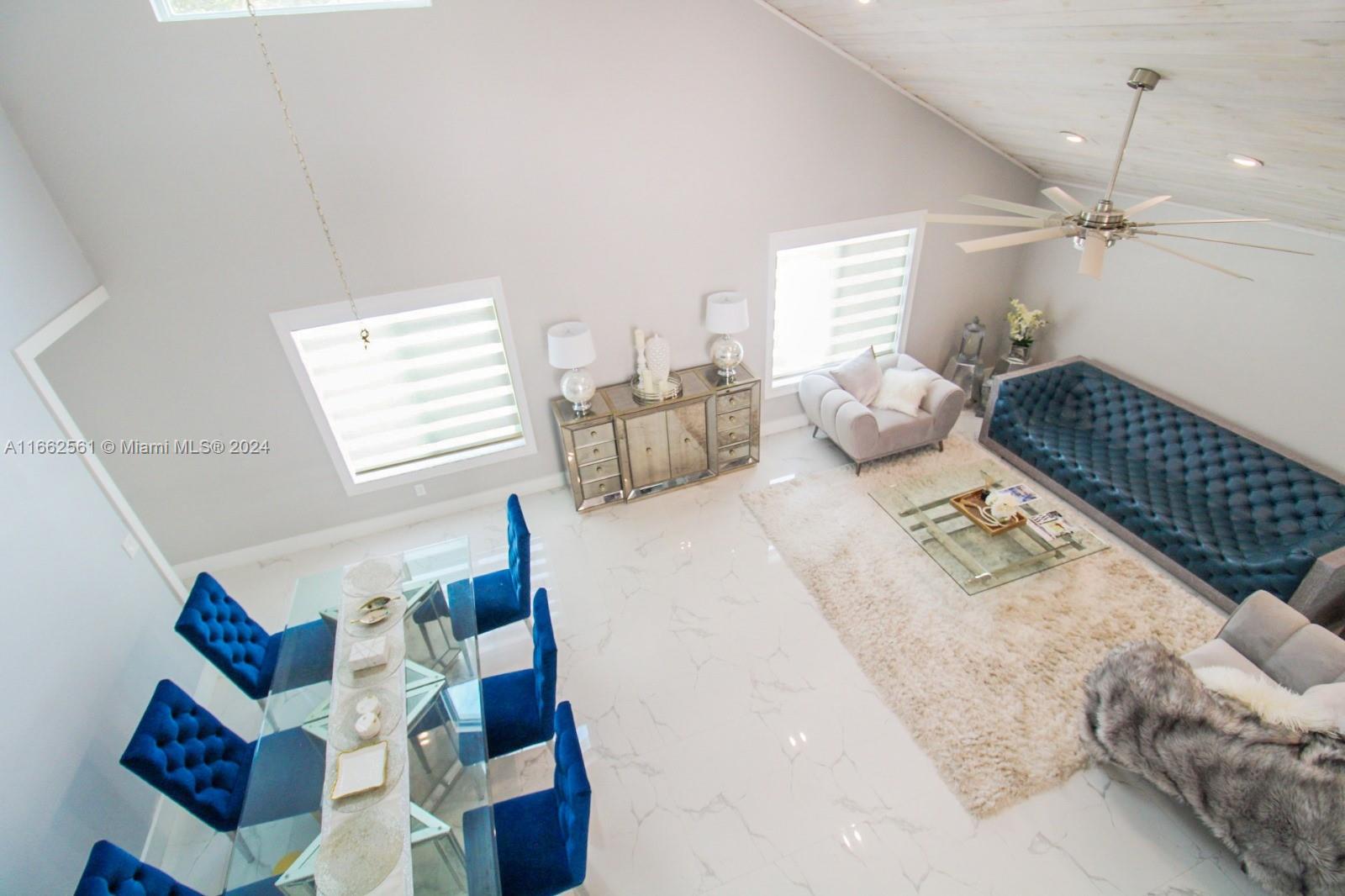 13505 Southwest 119th Street Miami, FL 33186 - Photo 3 of 25 a bedroom with furniture and a window